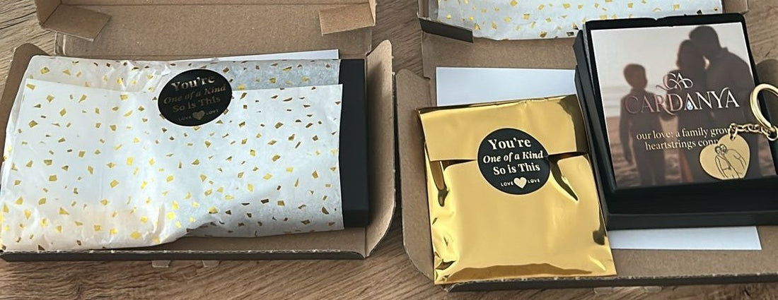 Cardanya premium jewelry unboxing experience featuring custom black boxes, gold-starred tissue paper, and personalized gift cards on a wooden table.