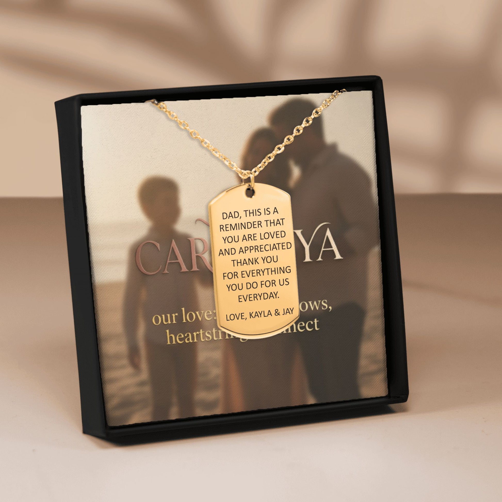 Cardanya gold dog tag necklace with personalized engraved message for Dad, displayed in a luxury gift box.